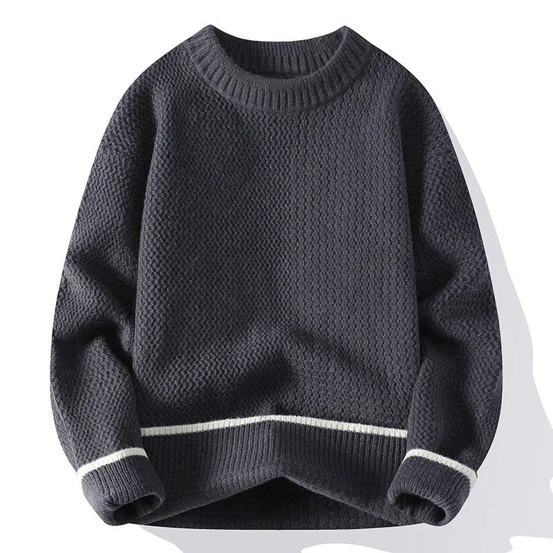 Man wearing a loose grey round neck pullover sweater, casual autumn outfit