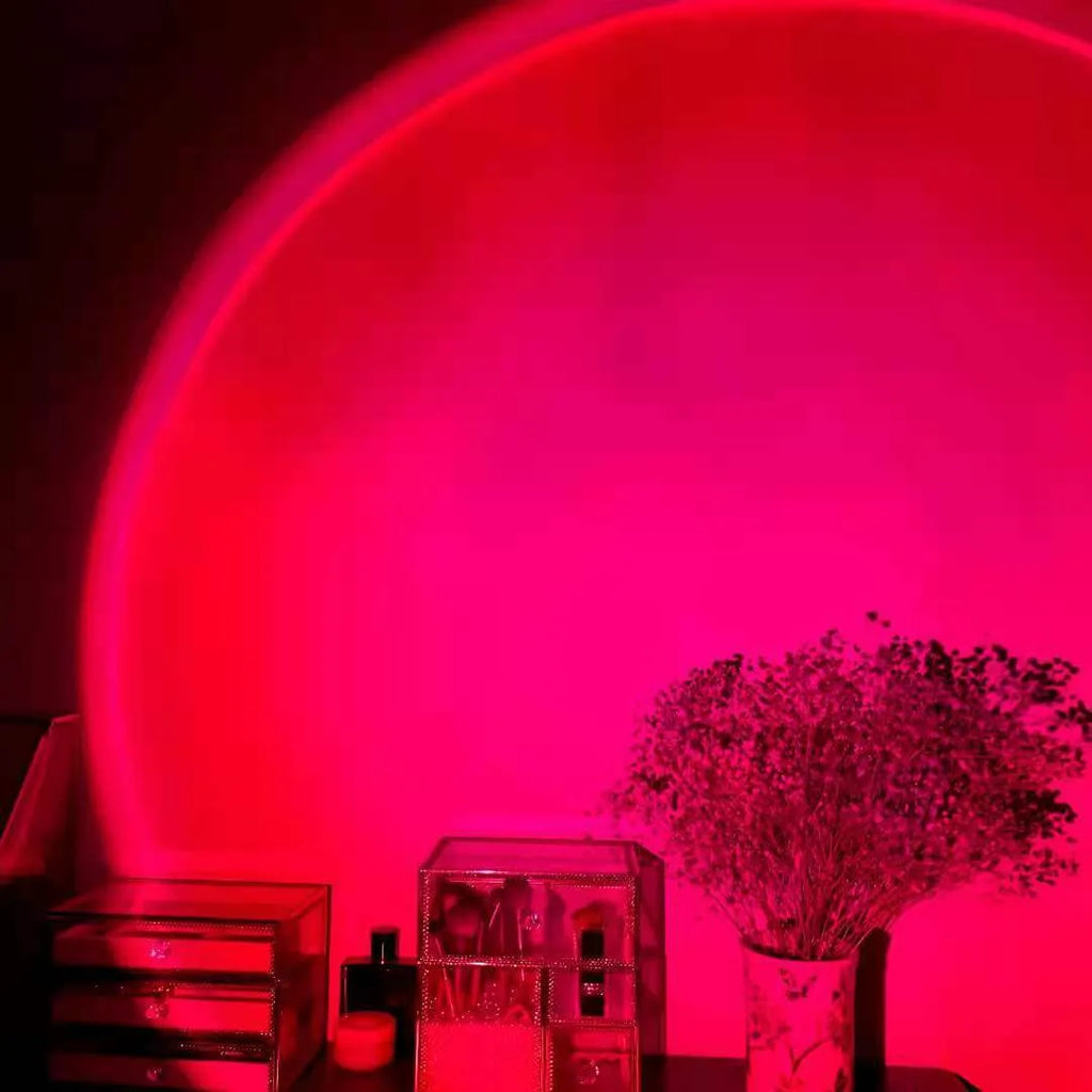 Rechargeable sunset red projection lamp casting rainbow light with push-button switch and USB cable