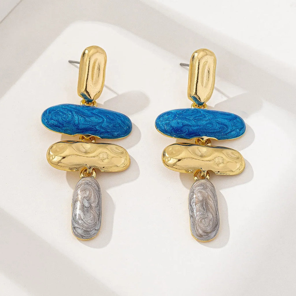 A pair of simple geometric stud earrings with a multicolour metallic electroplated finish.