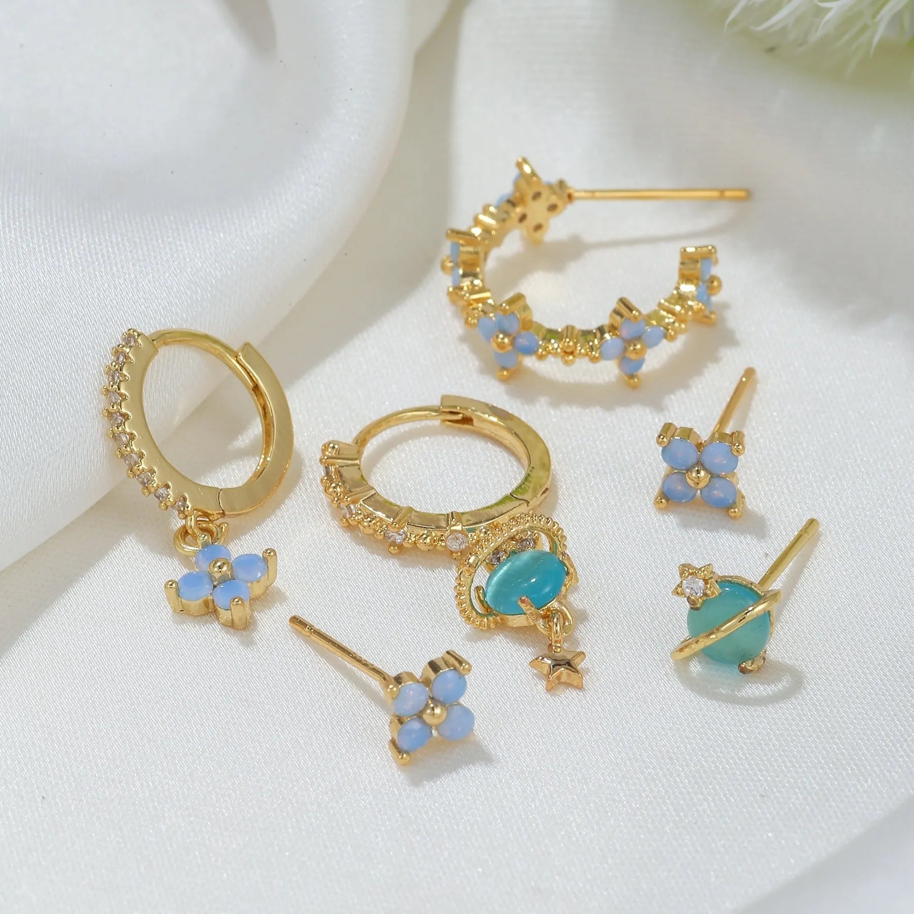 Japanese Korean style floral stud earrings with zircon detailing in gold or silver finish