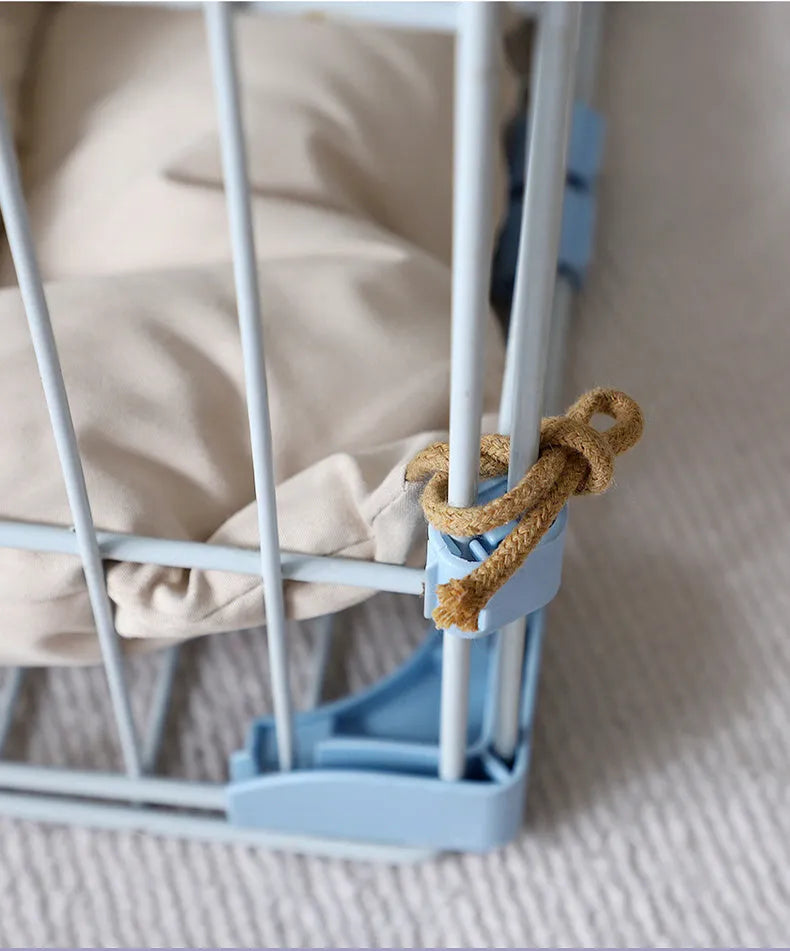 Beige cage cushion tied in a wire dog crate with soft padding for small pets