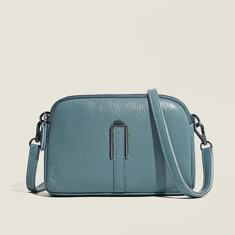 Genuine leather ladies shoulder bag in urban simplicity style, horizontal square shape, compact 19x13x6cm size.