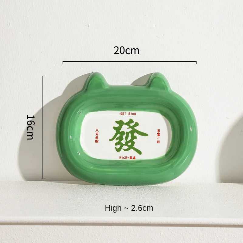 Ceramic animal-shaped cat bowl in a colourful design for pet feeding