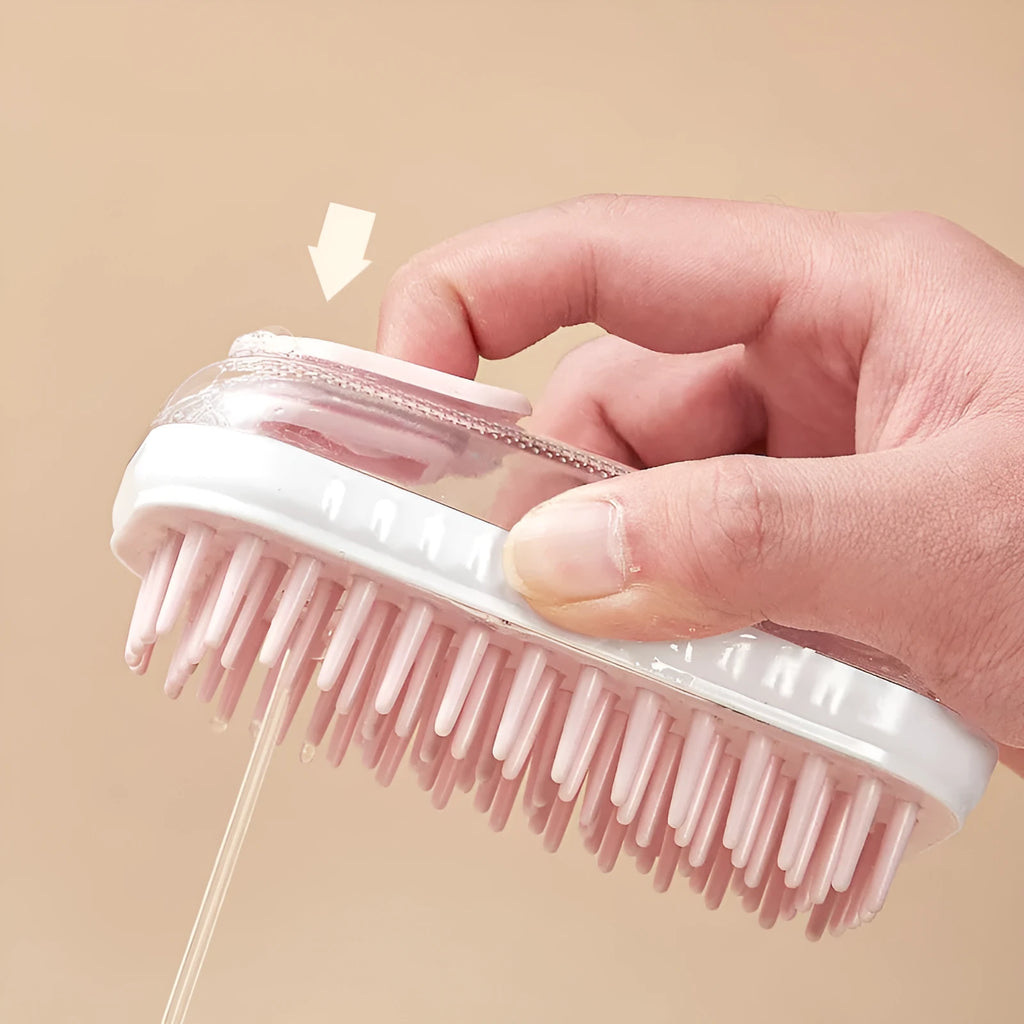 Grey silicone bath brush for pets with soft bristles and ergonomic handle on white background
