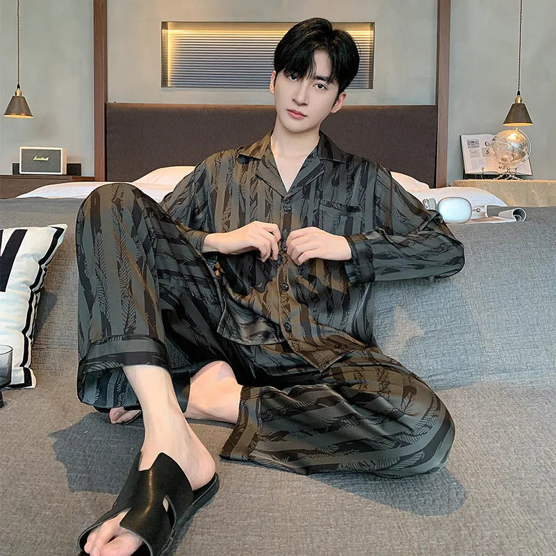 High-grade ice silk men's pyjama set V-neck long sleeve top and thin trousers in black stripes on a neutral background