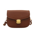 Simple PU leather handbag for women with zipper closure, available in multiple colours including black, brown, and green