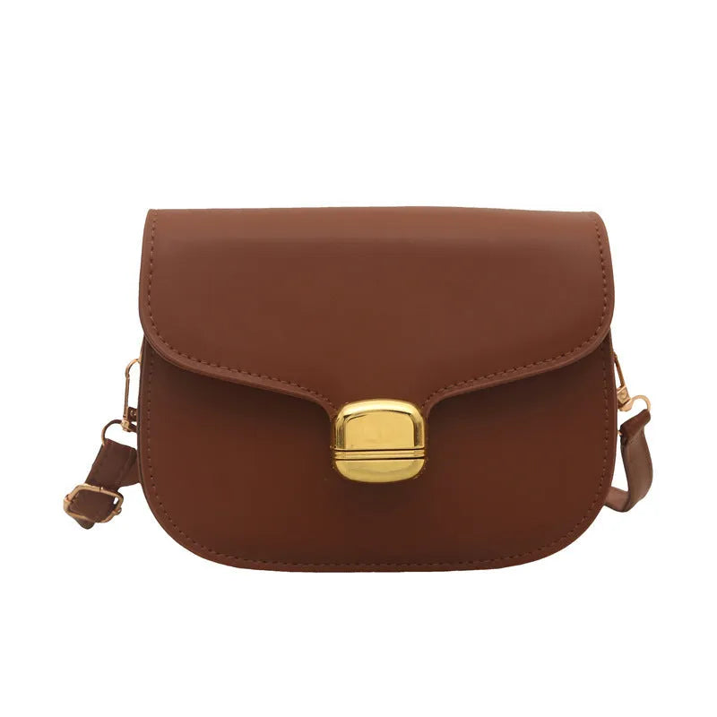 Simple PU leather handbag for women with zipper closure, available in multiple colours including black, brown, and green