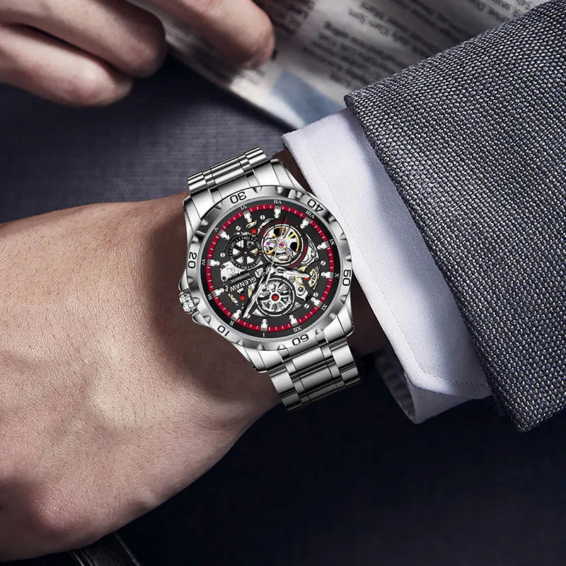 Silver automatic skeleton watch with stainless steel strap and transparent caseback showing mechanical movement