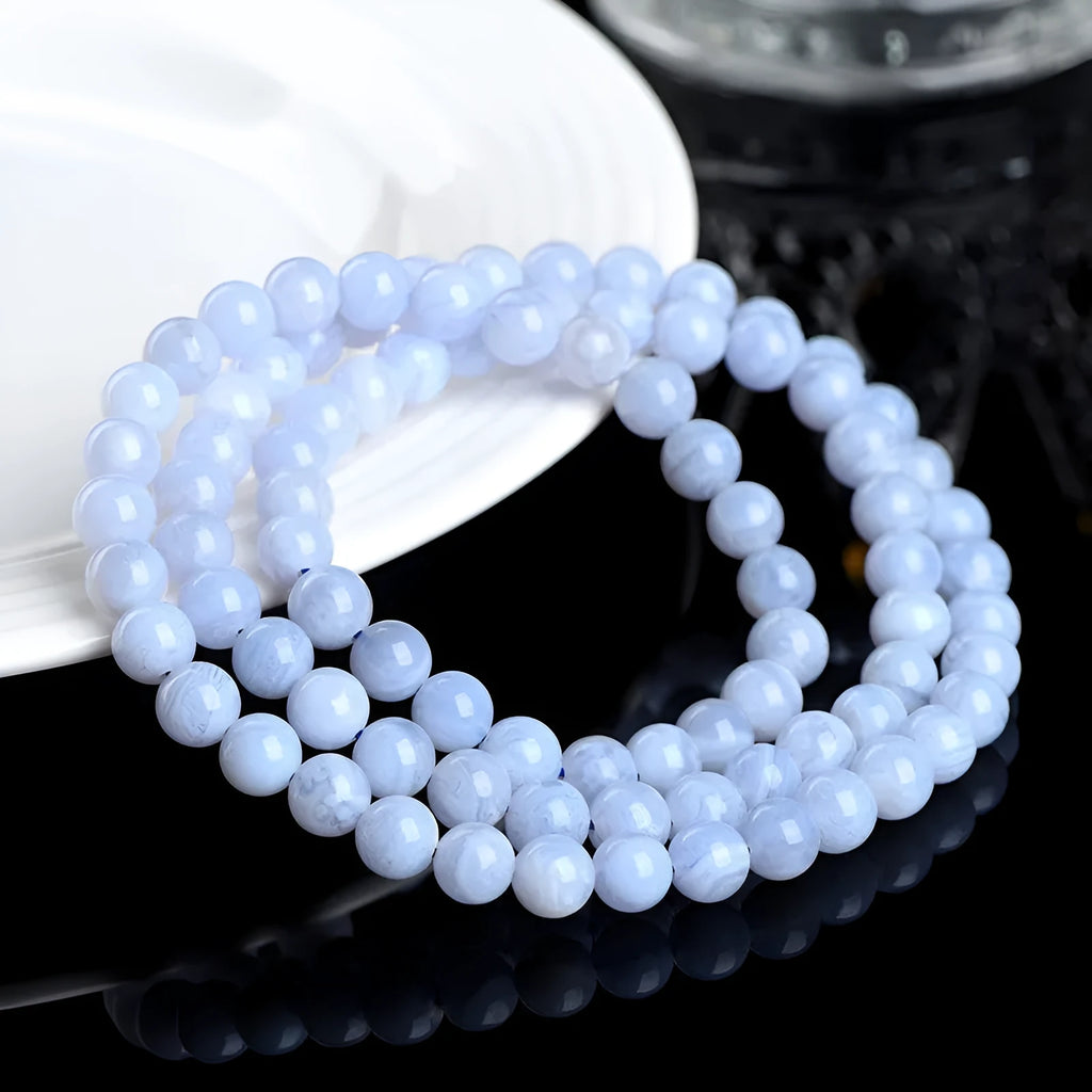 Blue agate multi-circle pattern bead bracelet with original design on a wrist