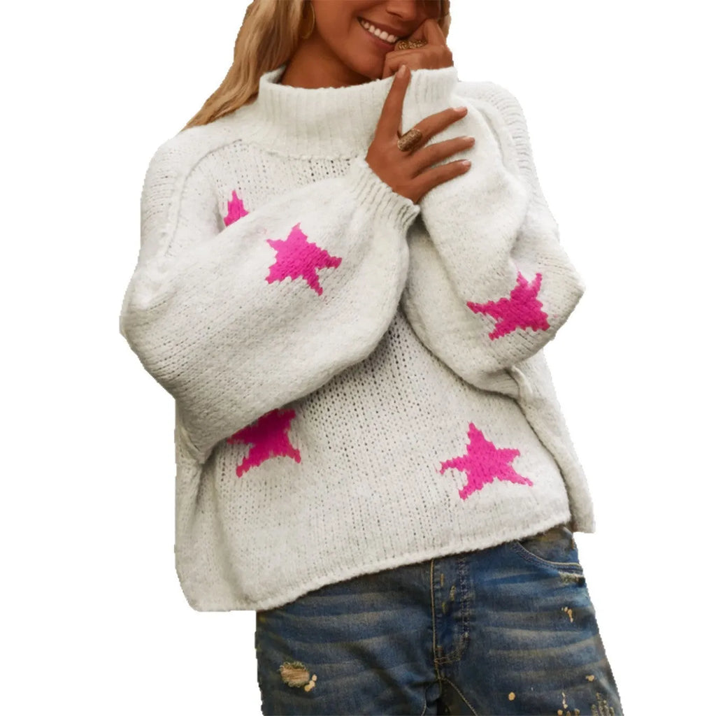 White women's turtleneck pullover sweater with a black five-pointed star pattern on the front.