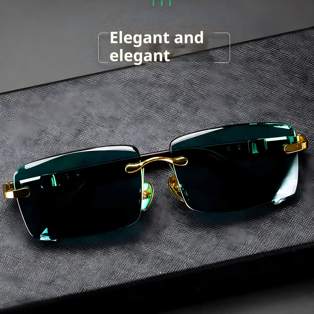 A pair of frameless rectangular sunglasses with dark green crystal lenses, a case, and a lens cloth.