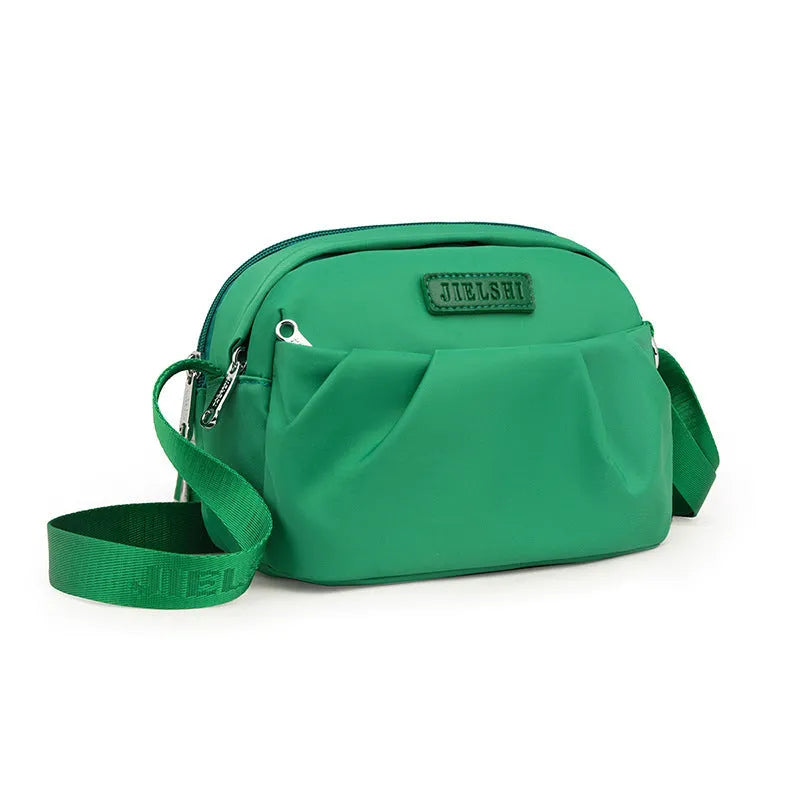 Pleated Oxford cloth shoulder messenger phone bag in horizontal square shape with single strap