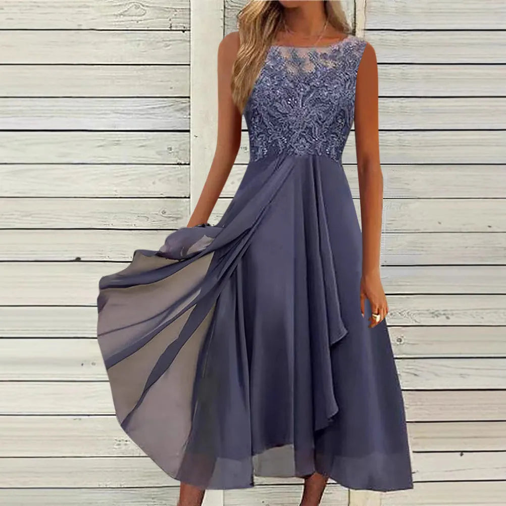 Women's sleeveless green chiffon dress with lace detailing and a mid-length skirt.