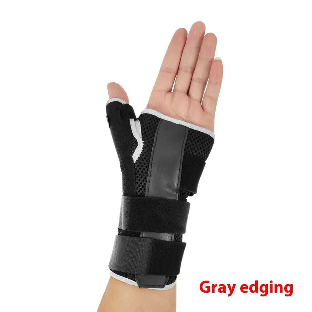 Carbon fibre sports wrist guard with thumb strap, shown in black with grey edging detail.