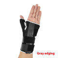 Carbon fibre sports wrist guard with thumb strap, shown in black with grey edging detail.