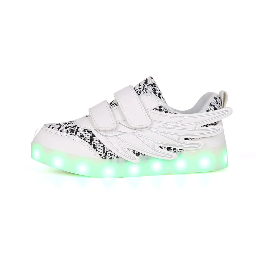 Children's plum red and white LED light up sneakers showing USB charging port and lights illuminated.