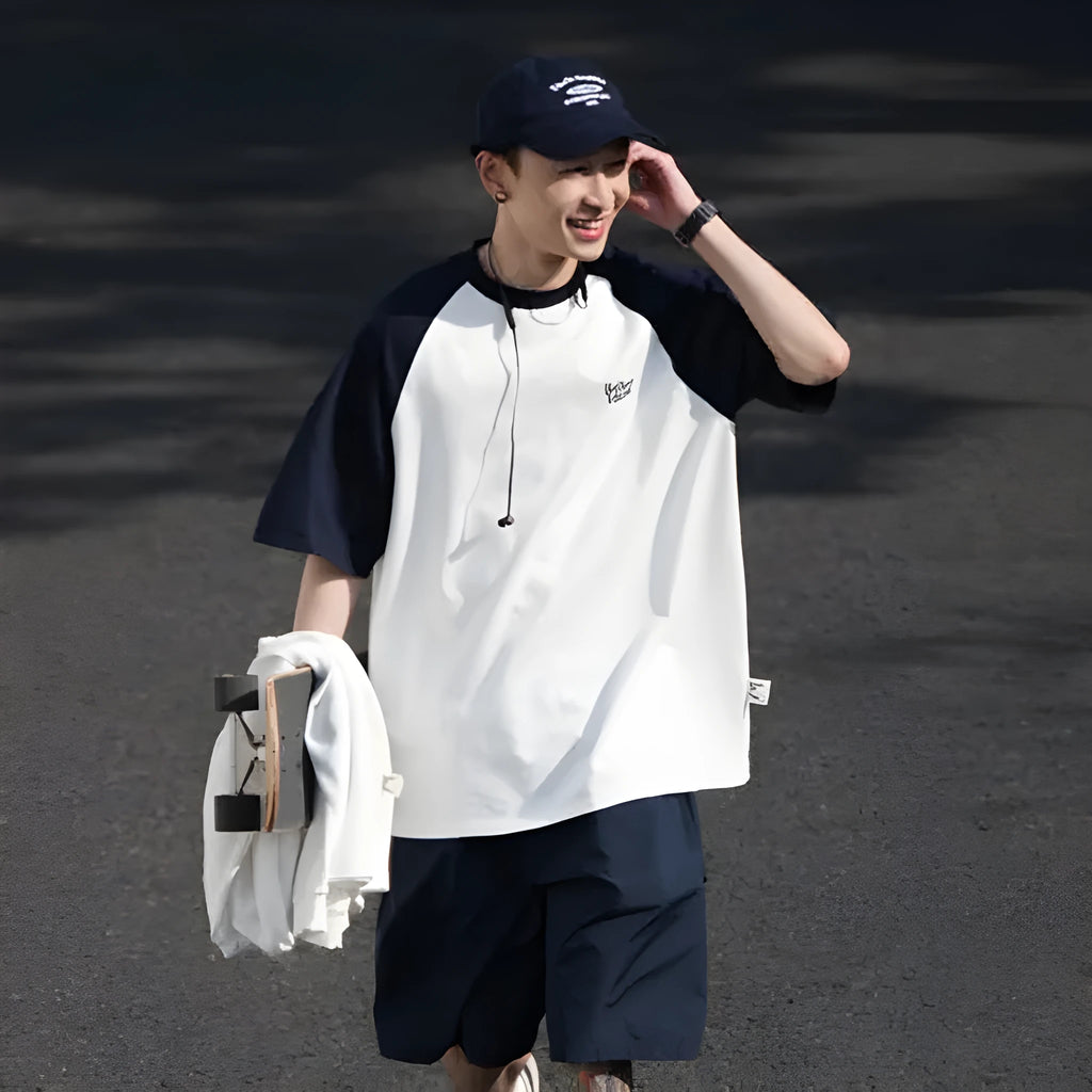 Blue loose-fit men's T-shirt with raglan sleeves in a Japanese Junior casual style.