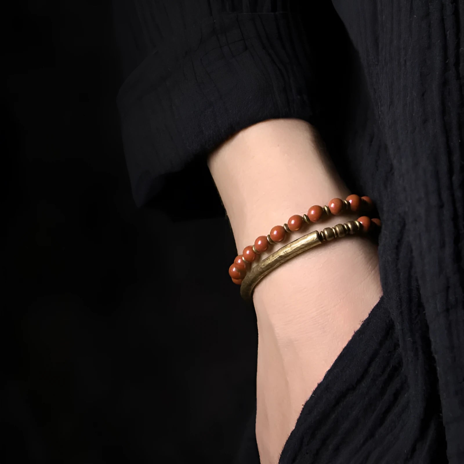 Layered retro ethnic bracelet featuring natural red jasper, obsidian, and water grass agate stones with brass elements