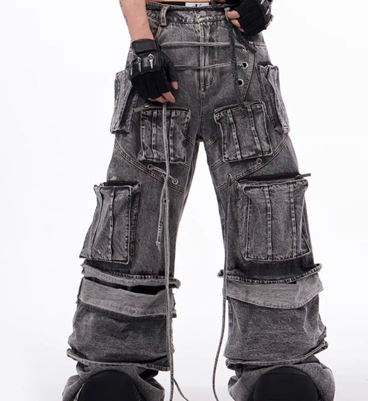 Grey cotton denim distressed overalls with rope stitching in mop pant style on model
