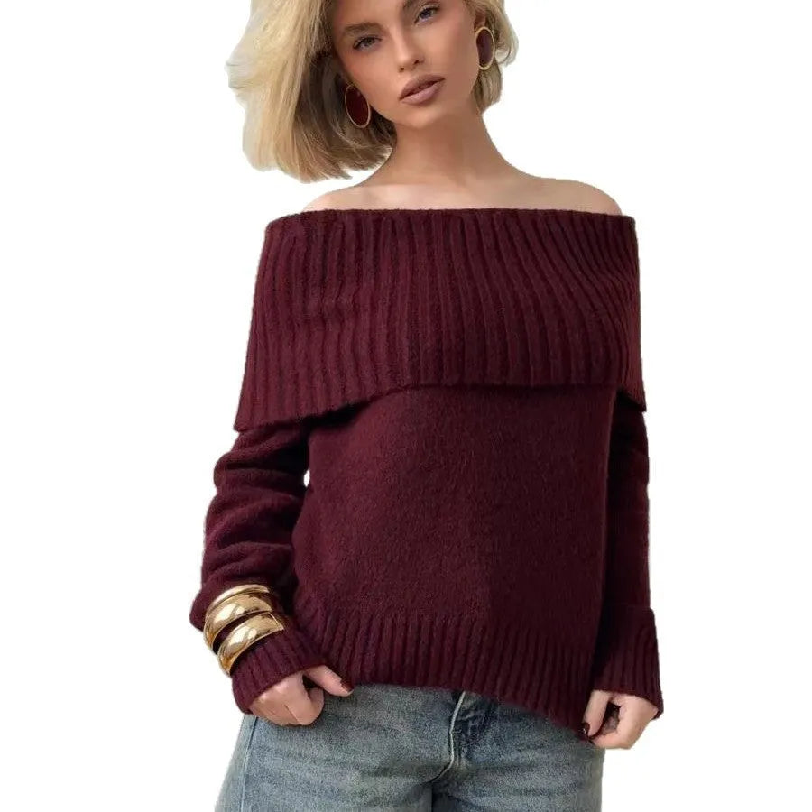 Grey off-the-shoulder acrylic sweater with a 3D pattern texture, modelled from the front.