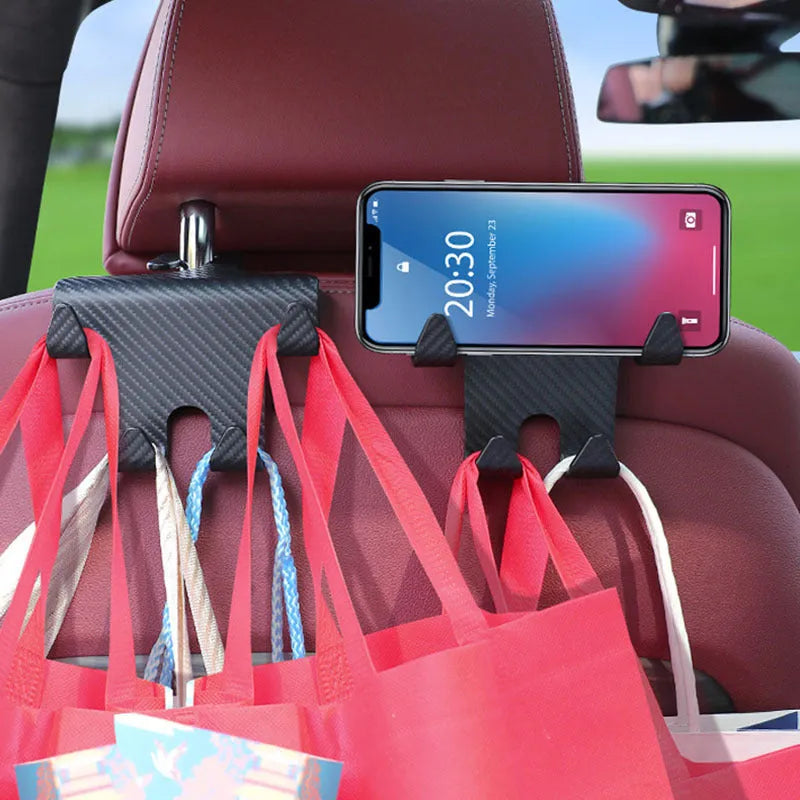Black ABS plastic car seat back hook with integrated mobile phone holder bracket.
