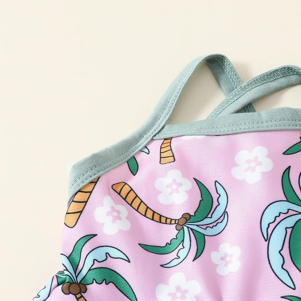 White children's two-piece swimsuit set with shirt and shorts on hanger