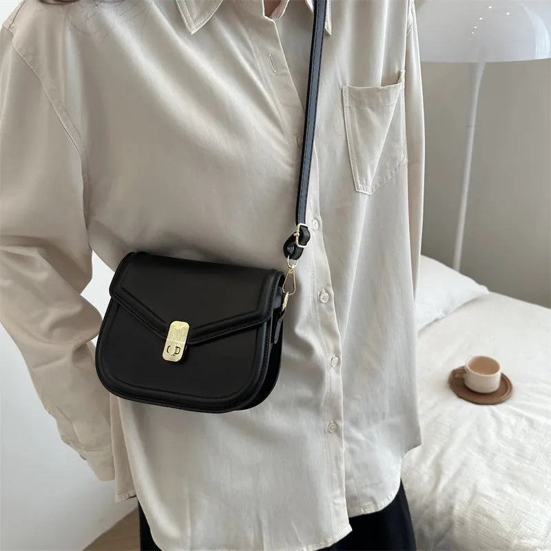 Soft black PU leather clamshell shoulder messenger bag shown open, featuring a horizontal square shape.