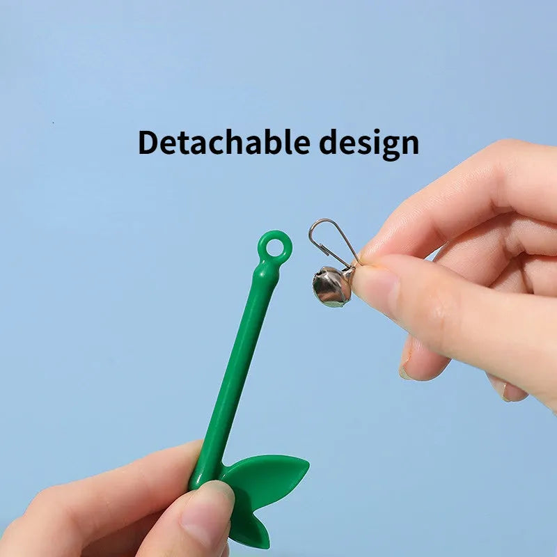 Green interactive cat toy feather wand with bell refills and feathers on a white background