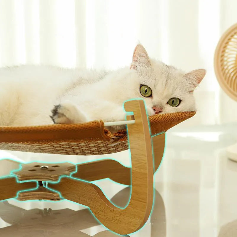 Brown woven rattan pet hammock bed for cats and dogs on a cool mat.