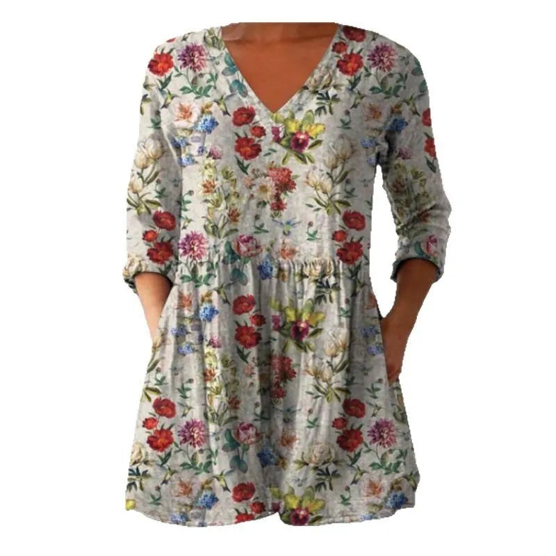 Women's printed loose dress with wide waist and 3/4 length sleeves on a hanger.