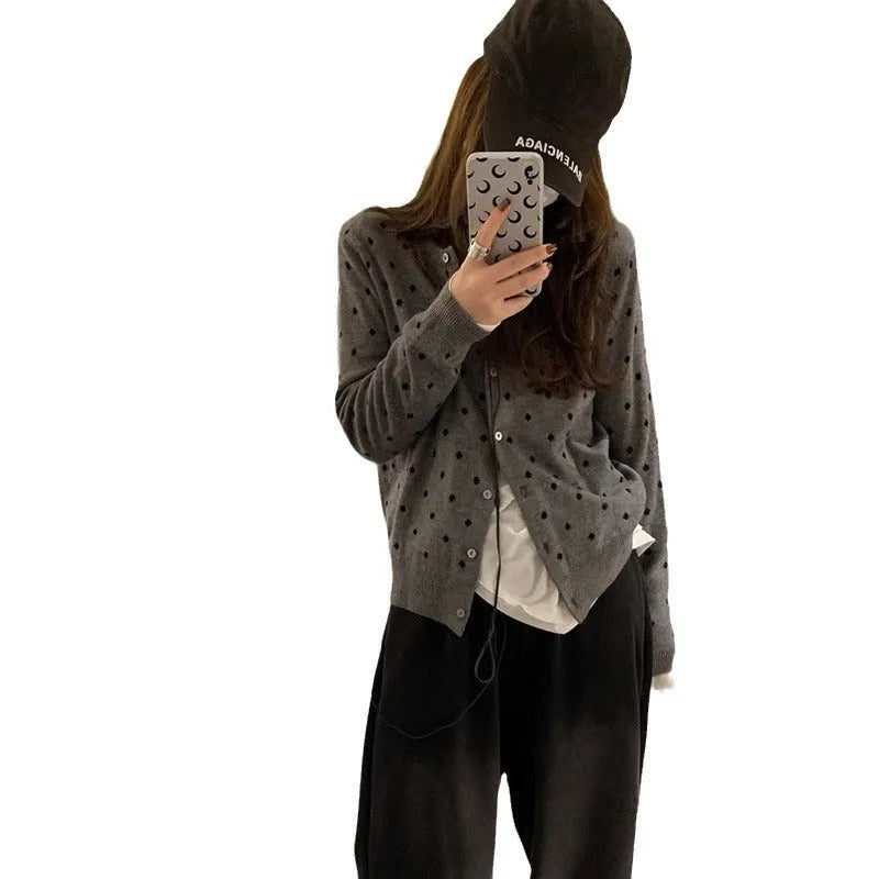 Grey Korean-style women's cardigan with white crocheted flower details on a mannequin.