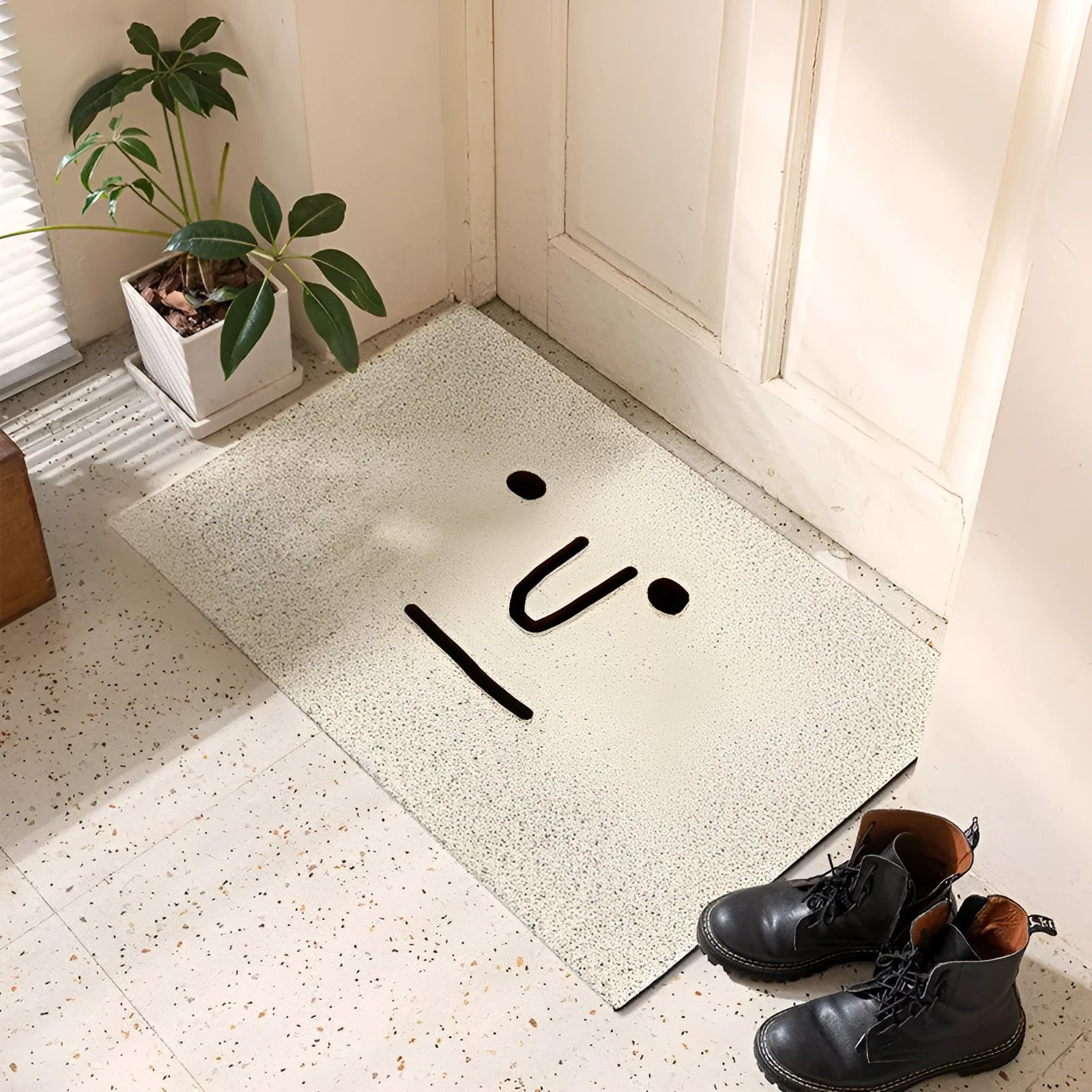 Square PVC floor mat with cartoon facial expression pattern in Mr Big Nose colour and steel traveller stitched edges