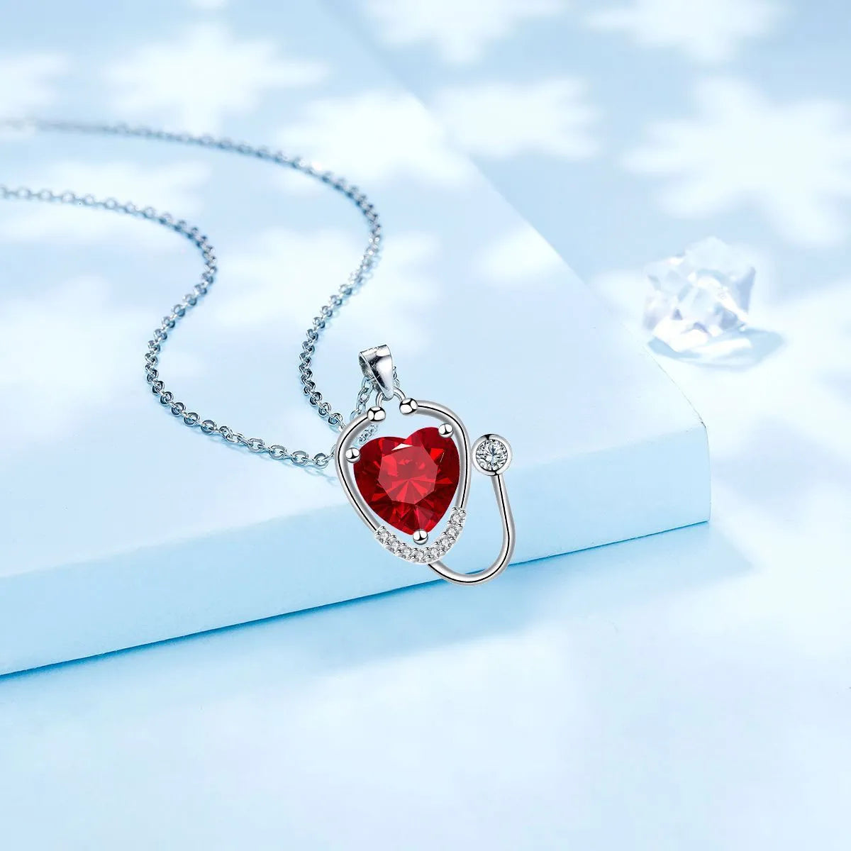 Women's red diamond stethoscope necklace with electroplated copper construction