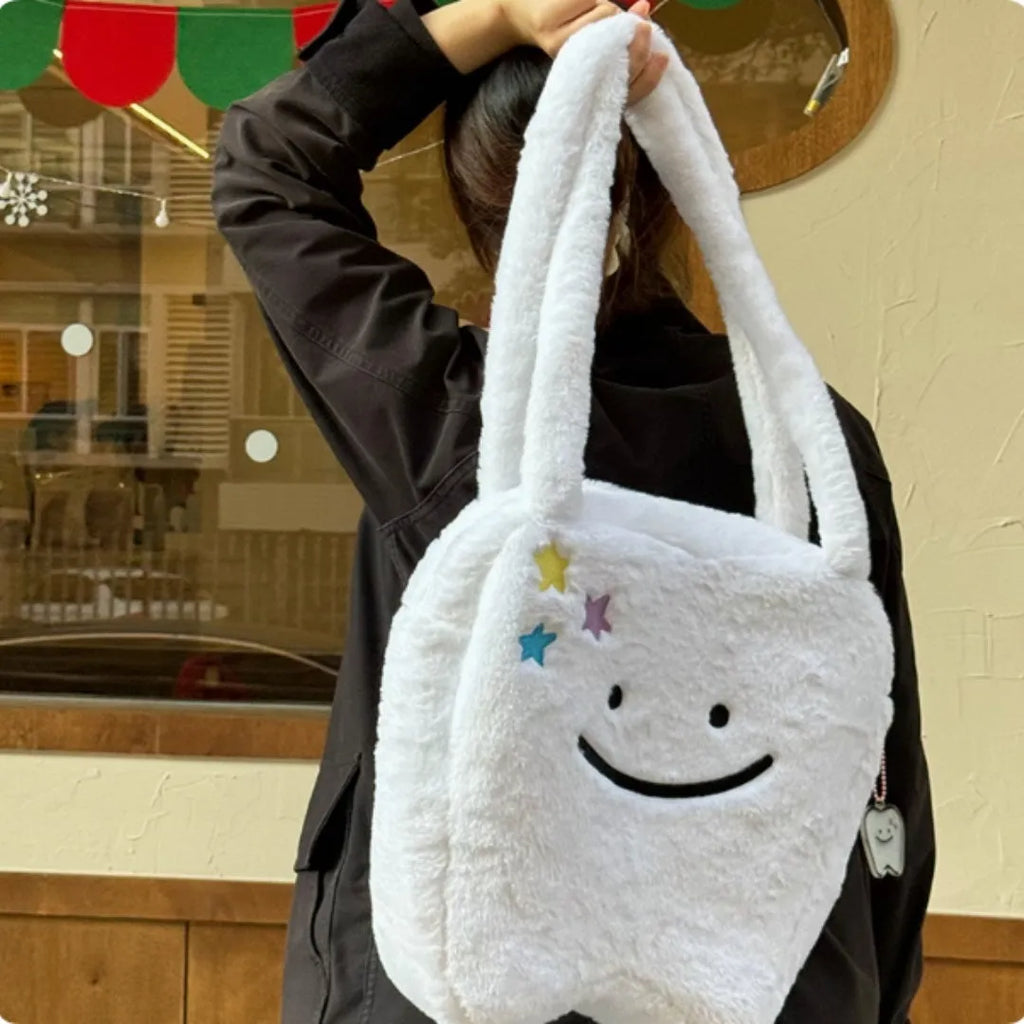 White plush shoulder tote bag with cute tooth pattern design and front zipper opening