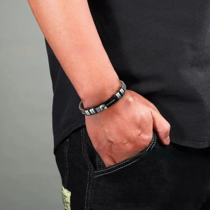 Men's stainless steel bracelet with leather rope band and lettering beads showing heart-shaped pendant