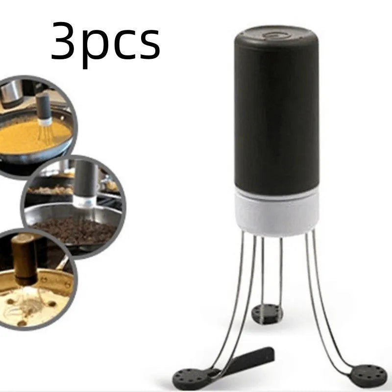 White and black wireless stir crazy mixer with stainless steel shaft on a kitchen countertop