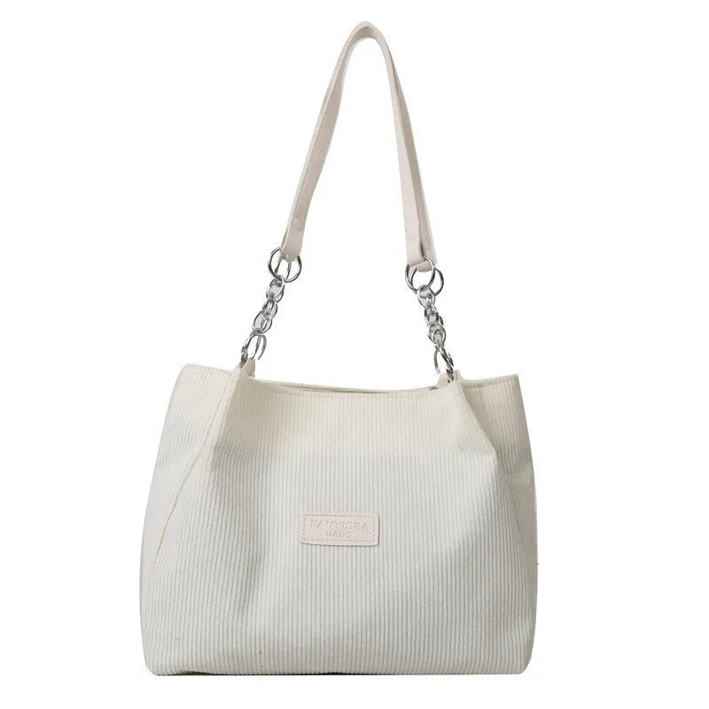 Corduroy one-shoulder tote bag in horizontal square shape with internal pockets