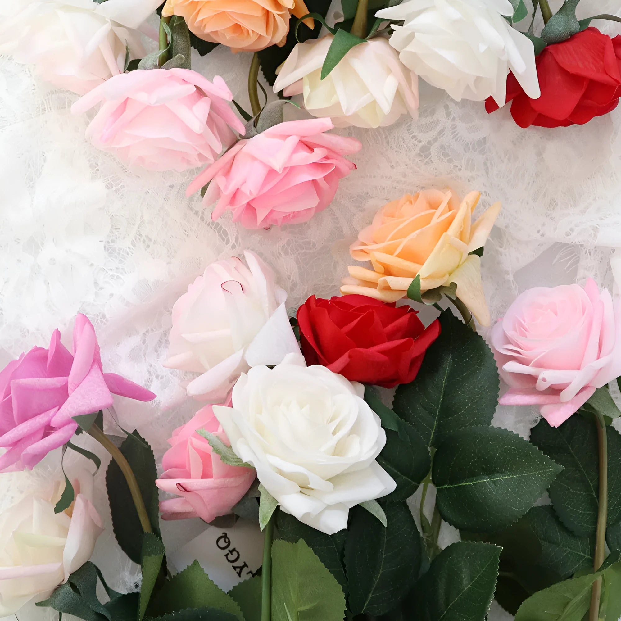 Artificial silk flower bouquet with red petals and green leaves measuring 42cm long