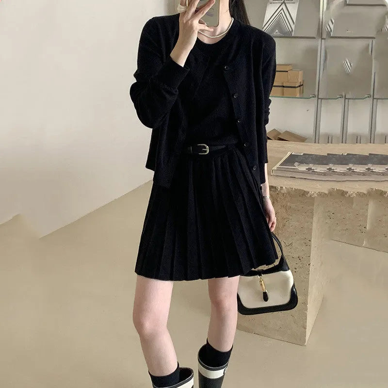 Grey and black women's knitted vest skirt and long-sleeved cardigan two-piece set with a belt.