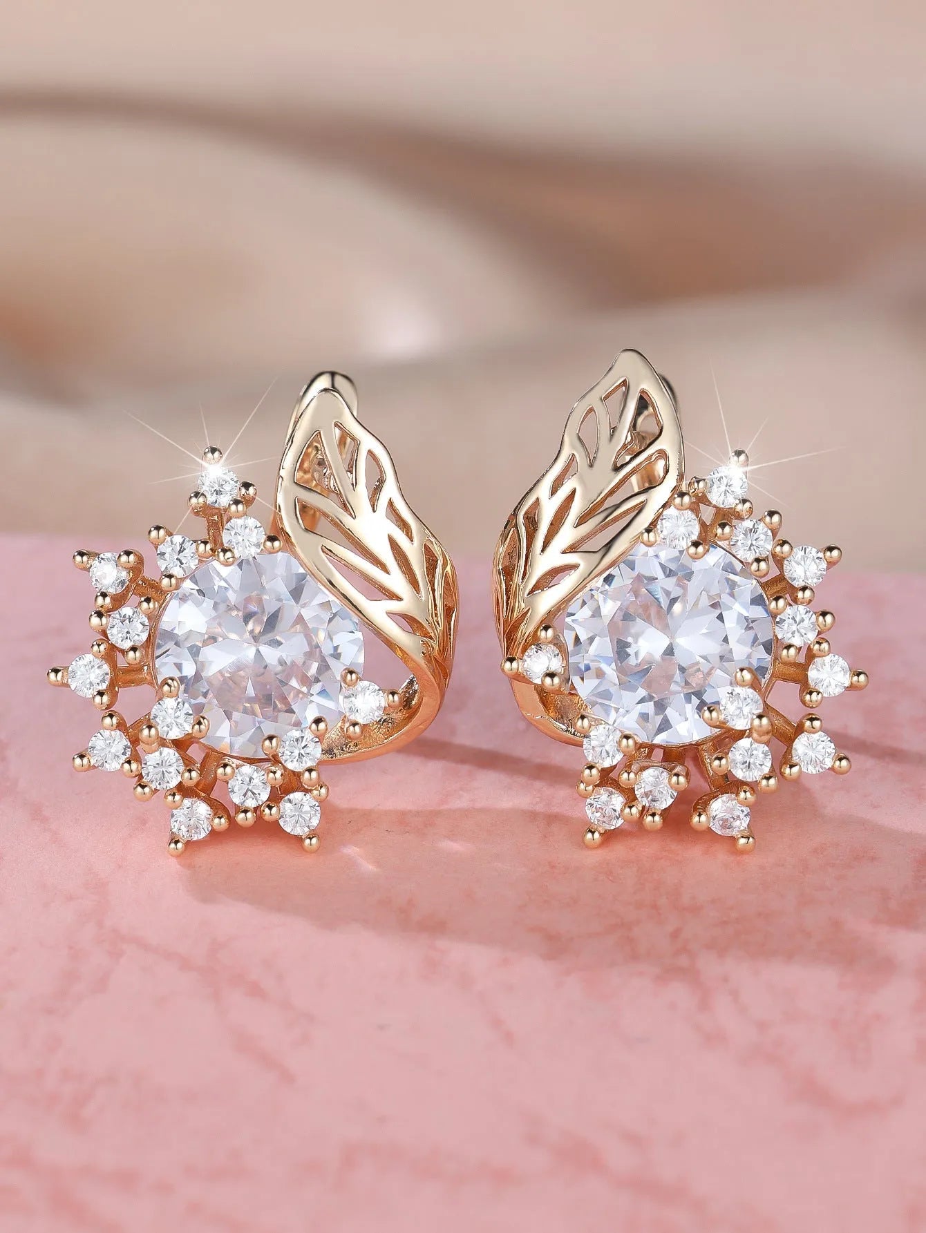 Round floral feather earrings with zircon stone centre in champagne gold finish, available in six coloured diamond options