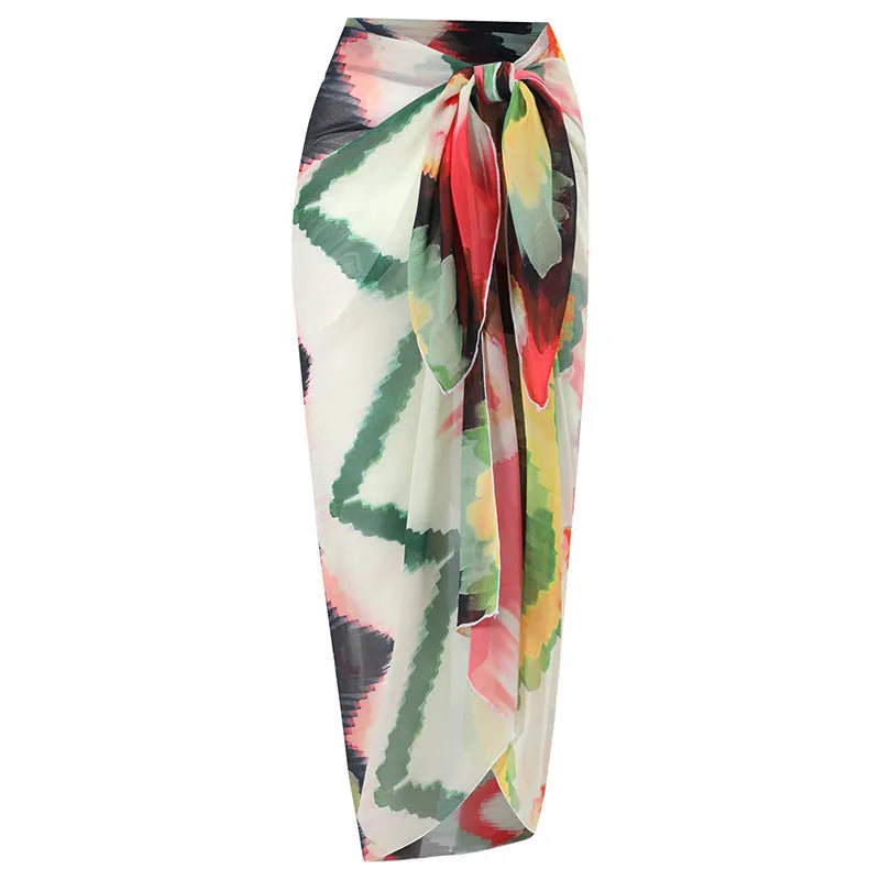 Women's printed two-piece swimsuit with matching hip skirt in striped gradient pattern.