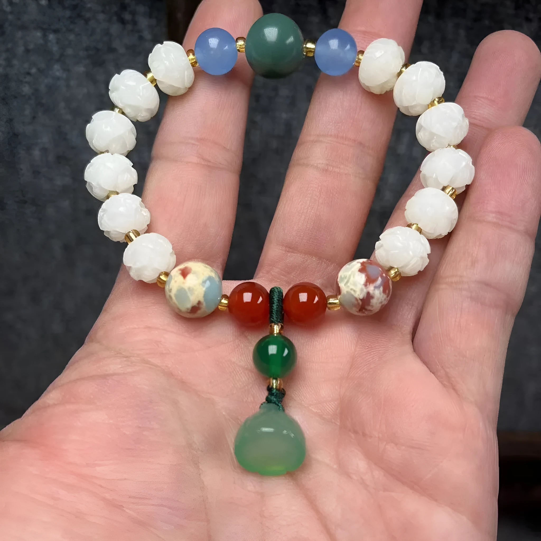 Bodhi root bracelet with carved lotus, pumpkin, and white jade beads in multiple sizes