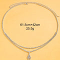 Gold rhinestone waist chain with tassel pendant and lobster buckle, 115cm length