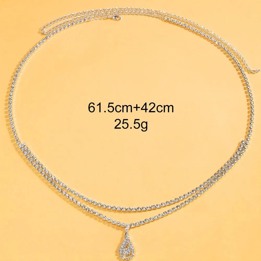 Gold rhinestone waist chain with tassel pendant and lobster buckle, 115cm length