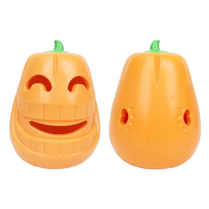 Orange Halloween pumpkin-shaped dog chew toy with a treat-dispensing funnel opening.