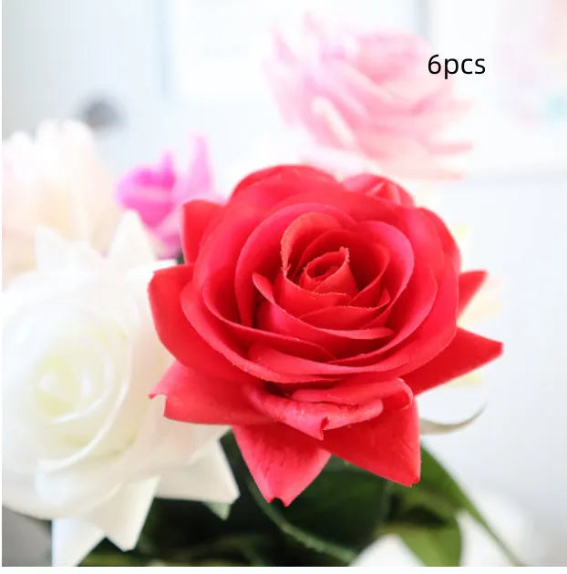 Artificial silk flower bouquet with red petals and green leaves measuring 42cm long