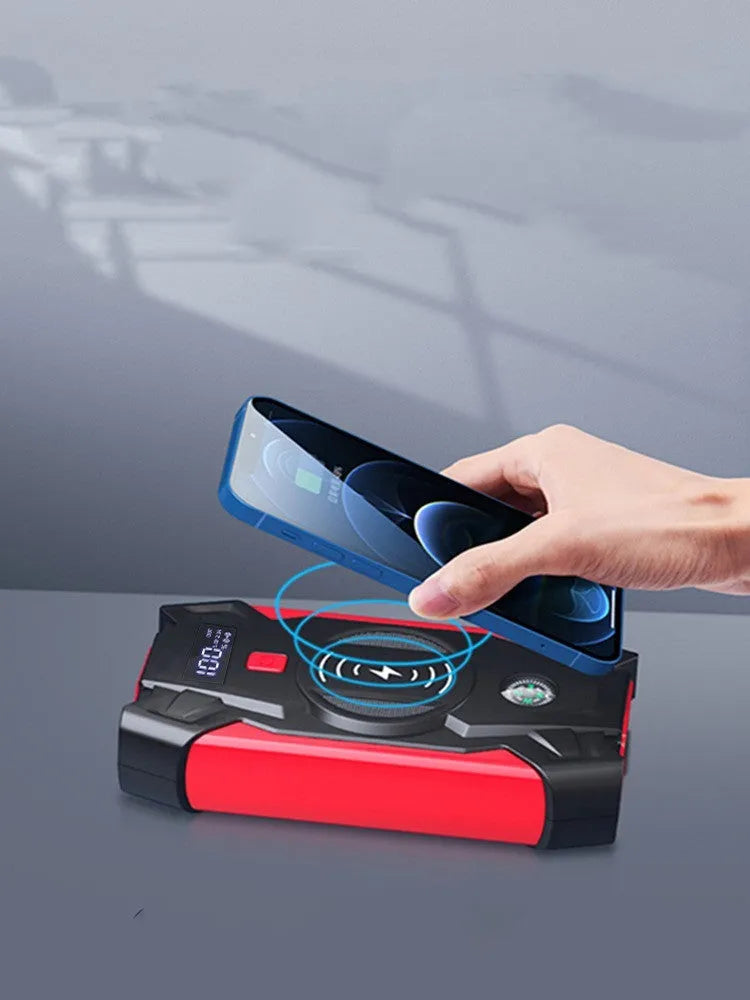 Red car emergency jump starter power bank with digital display and heavy-duty battery clips