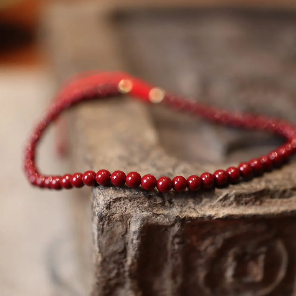 Natural cinnabar bracelet with purple gold sand design and geometric shape featuring Chinese auspicious patterns
