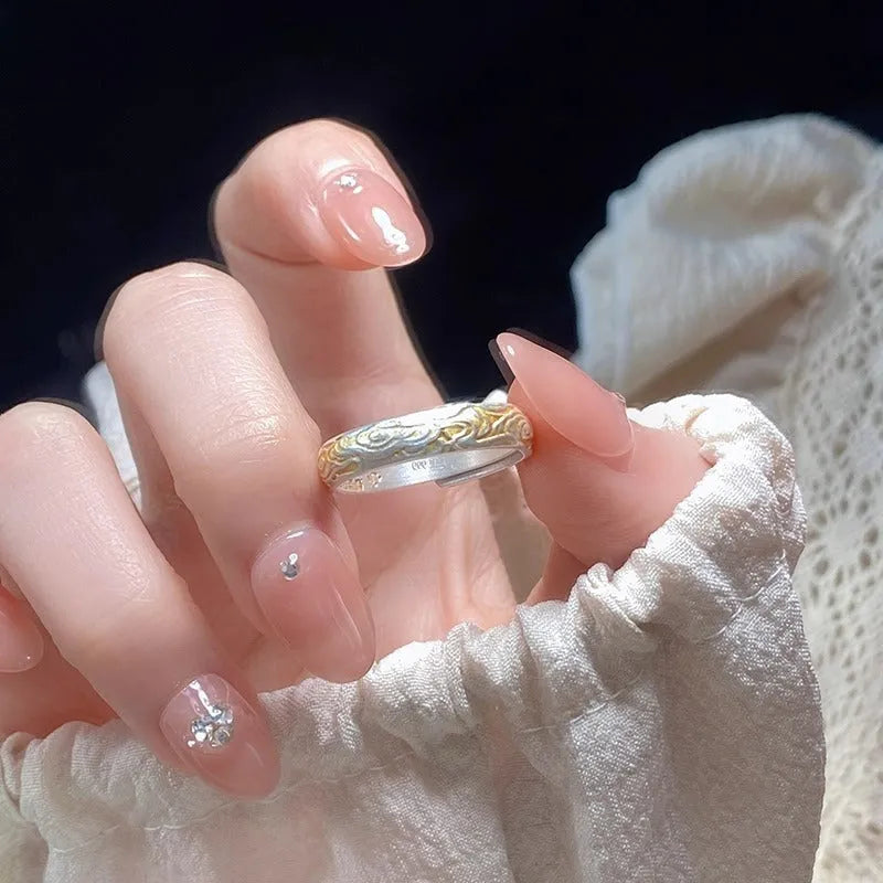 White copper open mouth ring with Xiangyun pattern and silver gold electroplated finish.