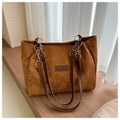 Corduroy one-shoulder tote bag in horizontal square shape with internal pockets